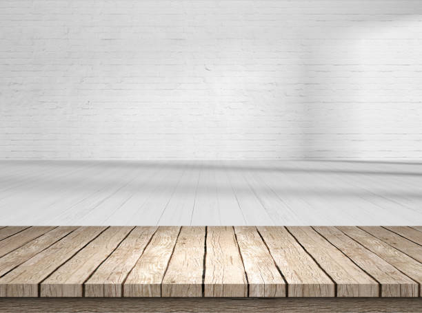 istock rustic blank wooden table top in front of blurry room 1199952836