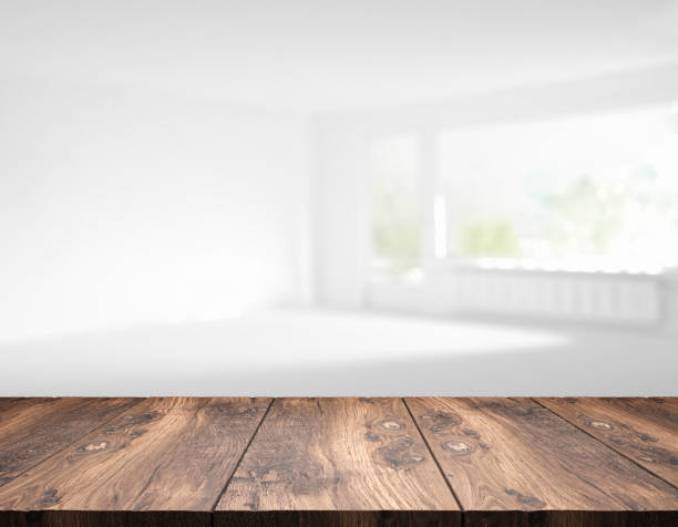 istock rustic blank wooden table top in front of blurry room 1199952858