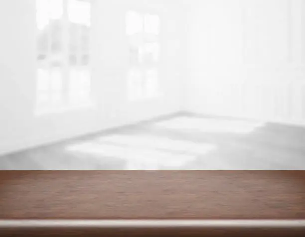 blank table top in front of blurry room - Illustration