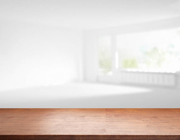 istock rustic blank wooden table top in front of blurry room 1199952912