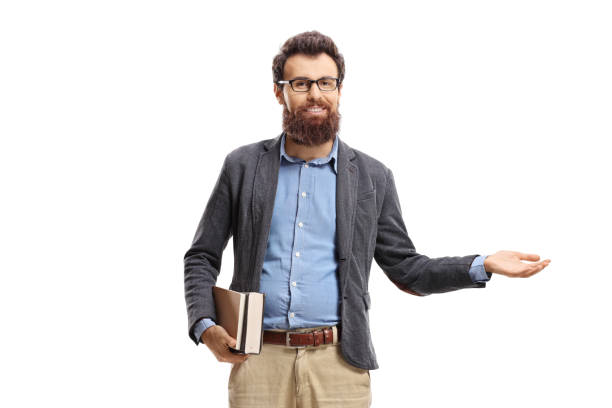 istock Bearded man holding books and making welcome gesture 1199955416