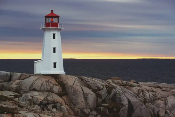 Iconic Peggy's Cove Lighthouse in evening light.