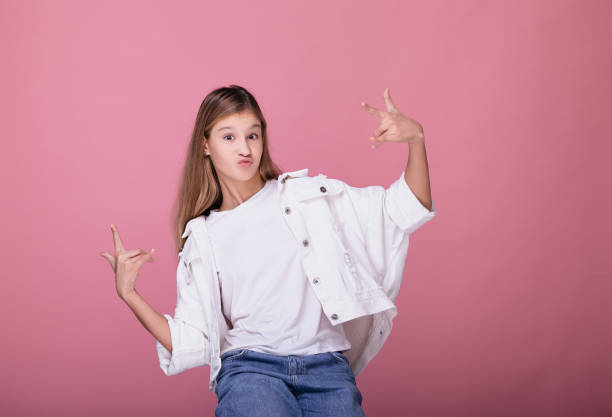 istock Cute blonde posing on a pink background. 1199956315