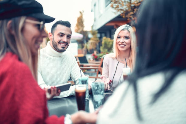 istock Friends Having A Talk Over Refreshments In Coffee Bar 1199958832