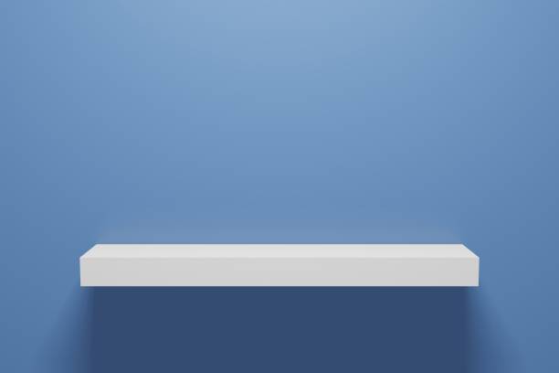 istock Realistic 3D rendering.  Front view of empty shelf on blue wall background with modern minimal concept. Display of room shelves for showing. 1199959568