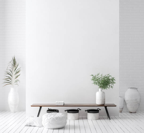 Wall mock up in white simple interior with wooden furniture, Scandi-Boho style stock photo