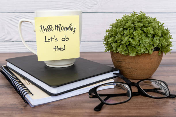 Inspirational quotes - Hello Monday, let's do this Inspirational quotes - Hello Monday, let's do this text on sticky note on top of table monday stock pictures, royalty-free photos & images