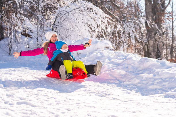 istock Mother and son on snow 1199961983