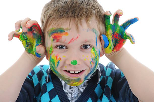 istock smiling boy with the palms painted by a paint. 119996433