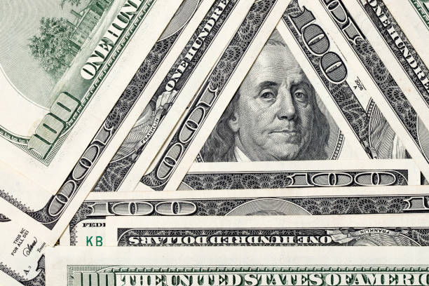 istock Triangle made of $100 bills with Benjamin Franklin inside 1199967940
