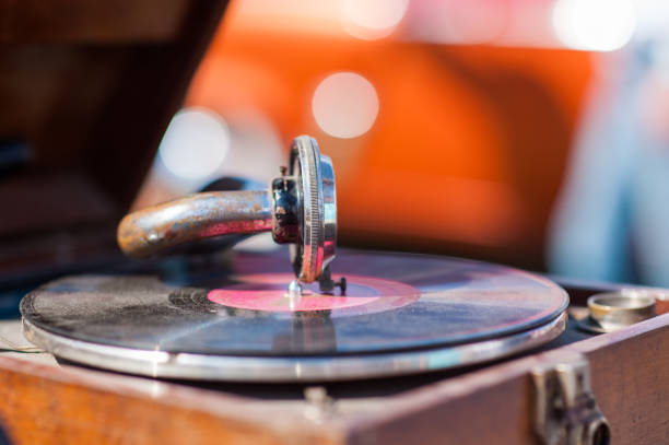 istock turntable player,dropping stylus needle on vinyl record playing 1199968857