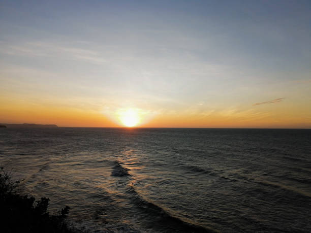 istock Sunset in the ocean 1199969422