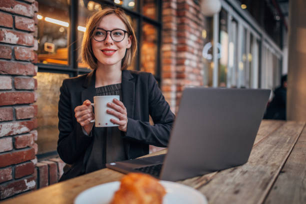 istock Pretty young woman drinking coffee 1199971403