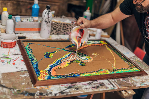 istock Artist painting in studio 1199975411