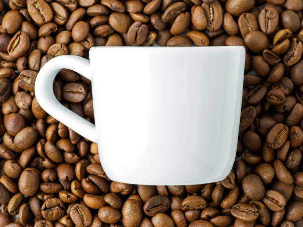 istock Coffee cup with beans on the background. 1199975817
