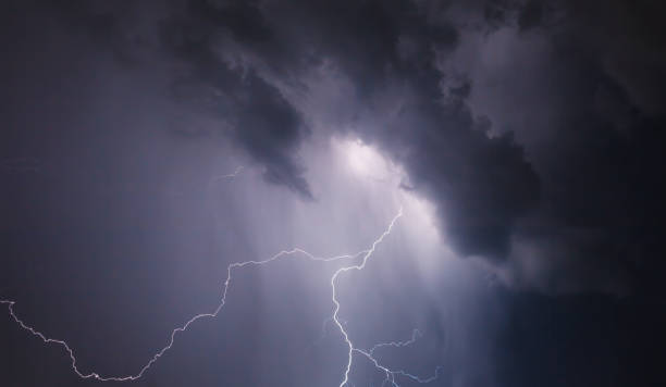 istock Dark ominous clouds. Thunderstorm with lightning. 1199981462