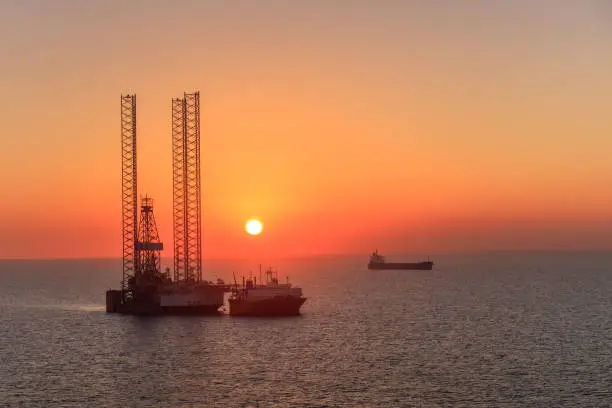 oil rig platform in sunrise. Persian Gulf