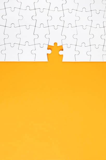 istock Jigsaw Puzzle on Yellow Background 1199984340