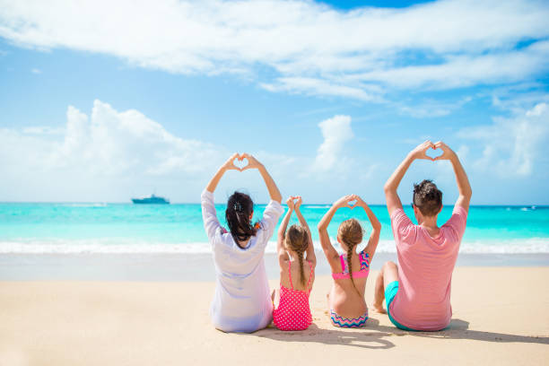istock Happy family on the beach during summer vacation 1199985335