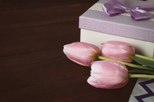 istock Tulips, Gift Box on a Dark Wooden Background 1199990073