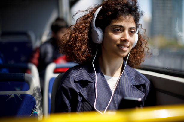 istock Young woman commuting by public transport 1199990451
