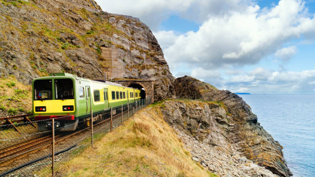 Closeup of train exiting a tunnel. View from Cliff Walk Bray to Greystones, Ireland stock photo