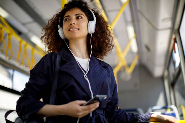 istock Female passenger using public transport 1199991079