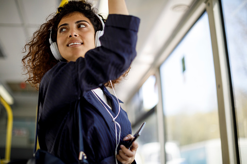 Young woman travelling by public transport