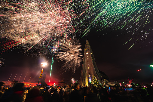 People celebrating New Year 2020 and using fireworks. 01.01.2020, Reykjavik, Iceland.
