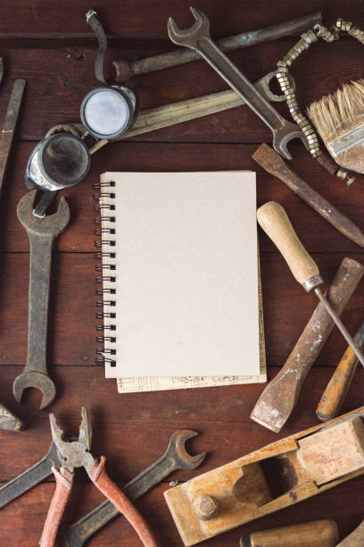 istock Vintage Work Tool, Notebook on Dark Wooden Background. Concept Father's Day. Flat lay, top view 1199993542