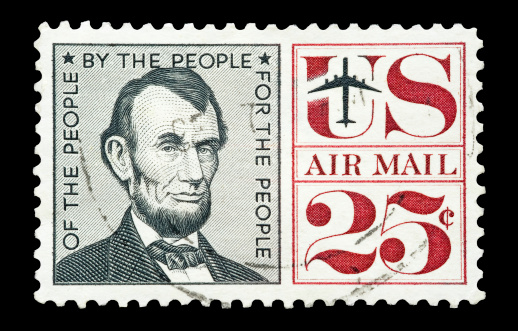 Issued in 1960 this United States Postage airmail stamp features a portrait of Abraham Lincoln and a famous line from his Gettysburg Address.
