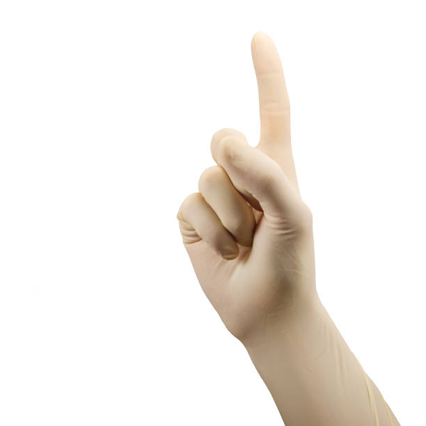 istock hand in surgical glove shows first palm isolated on white 1199994518