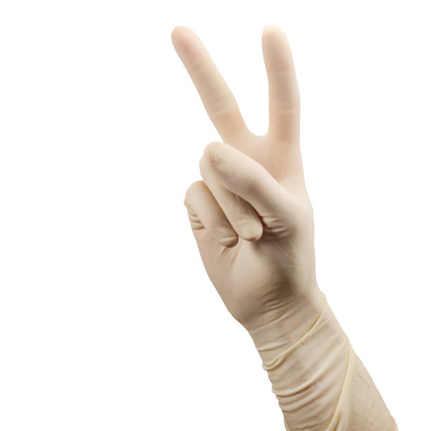 ręka w rękawiczce chirurgicznej pokazuje dwie dłonie wyizolowane na białym - doctors office examination table medical exam clinic zdjęcia i obrazy z banku zdjęć