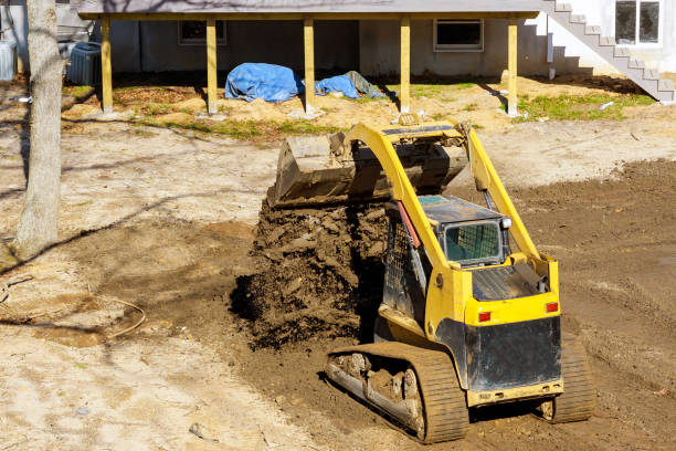 istock Bulldozer moving, leveling ground at construction site 1199994763