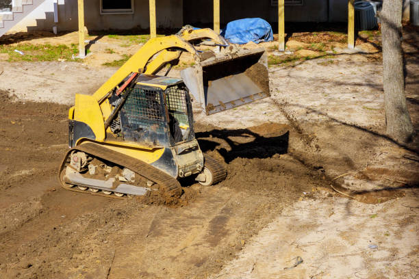 istock Mini bulldozer with earth doing landscaping works 1199994766