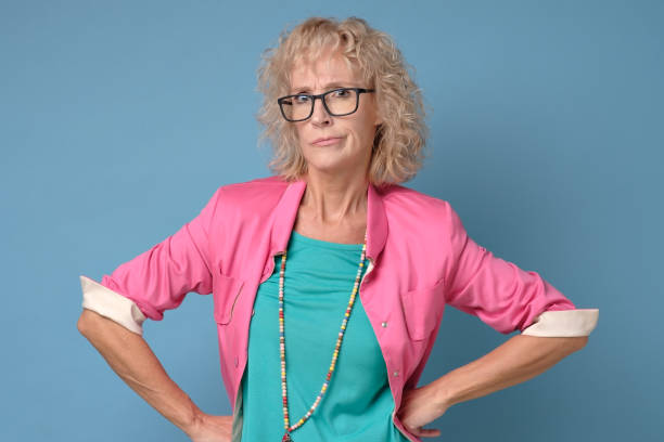 istock Angry elderly mother with irritated expression looking on her children 1199994768