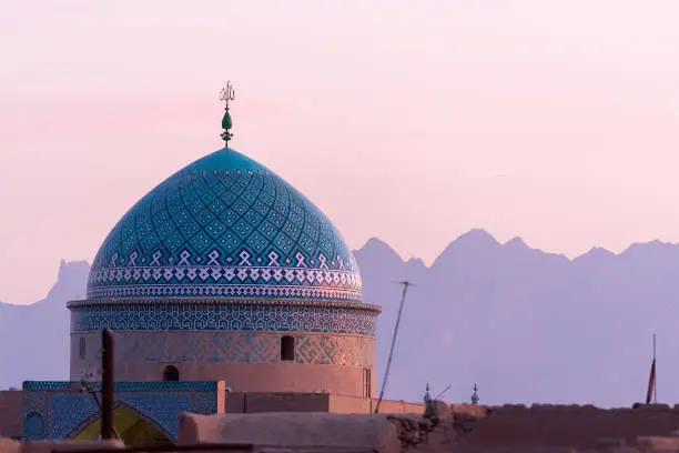 Colorfully ornamented dome in Yazd at sunset, Iran