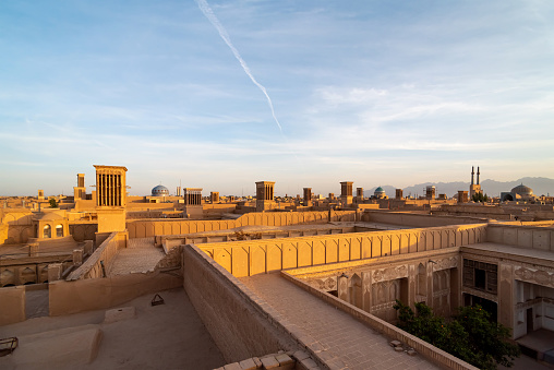 Views of the skyline with windtowers of Yazd at sunset, Iran