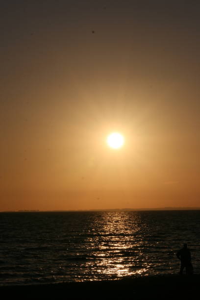 istock A beautiful sunset with a continuous sunset until the sun goes down on the horizon 1199998162