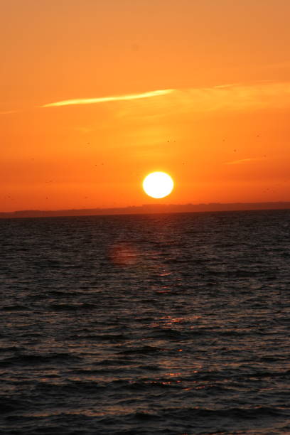 istock A beautiful sunset with a continuous sunset until the sun goes down on the horizon 1199998223