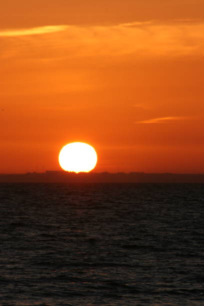 istock A beautiful sunset with a continuous sunset until the sun goes down on the horizon 1199998232