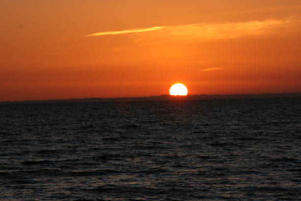 istock A beautiful sunset with a continuous sunset until the sun goes down on the horizon 1199998241