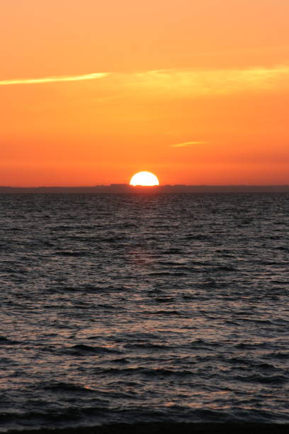 istock A beautiful sunset with a continuous sunset until the sun goes down on the horizon 1199998259