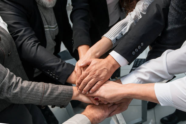 istock group of diverse professionals showing their unity 1199999145