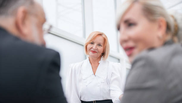 istock close up. a group of employees works in a modern office 1199999150