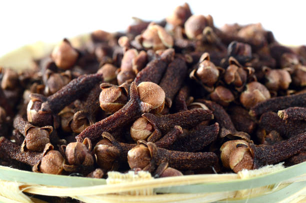istock Cloves (spice) in bamboo basket isolated on white background 1200006684