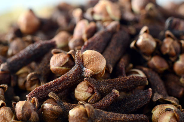 istock Cloves (spice) in bamboo basket isolated on white background 1200008105