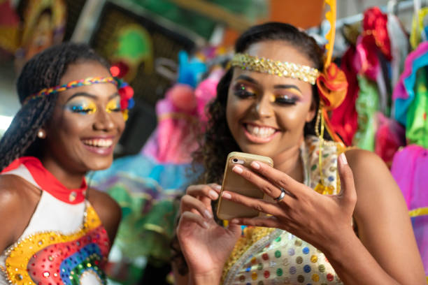 istock Females dancers using mobile phone 1200009454