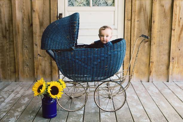 Baby Boy in Vintage Pram stock photo