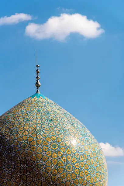 Colorfully ornamented minarets and dome at Shrine of Fatima Masuma in Qom, Iran